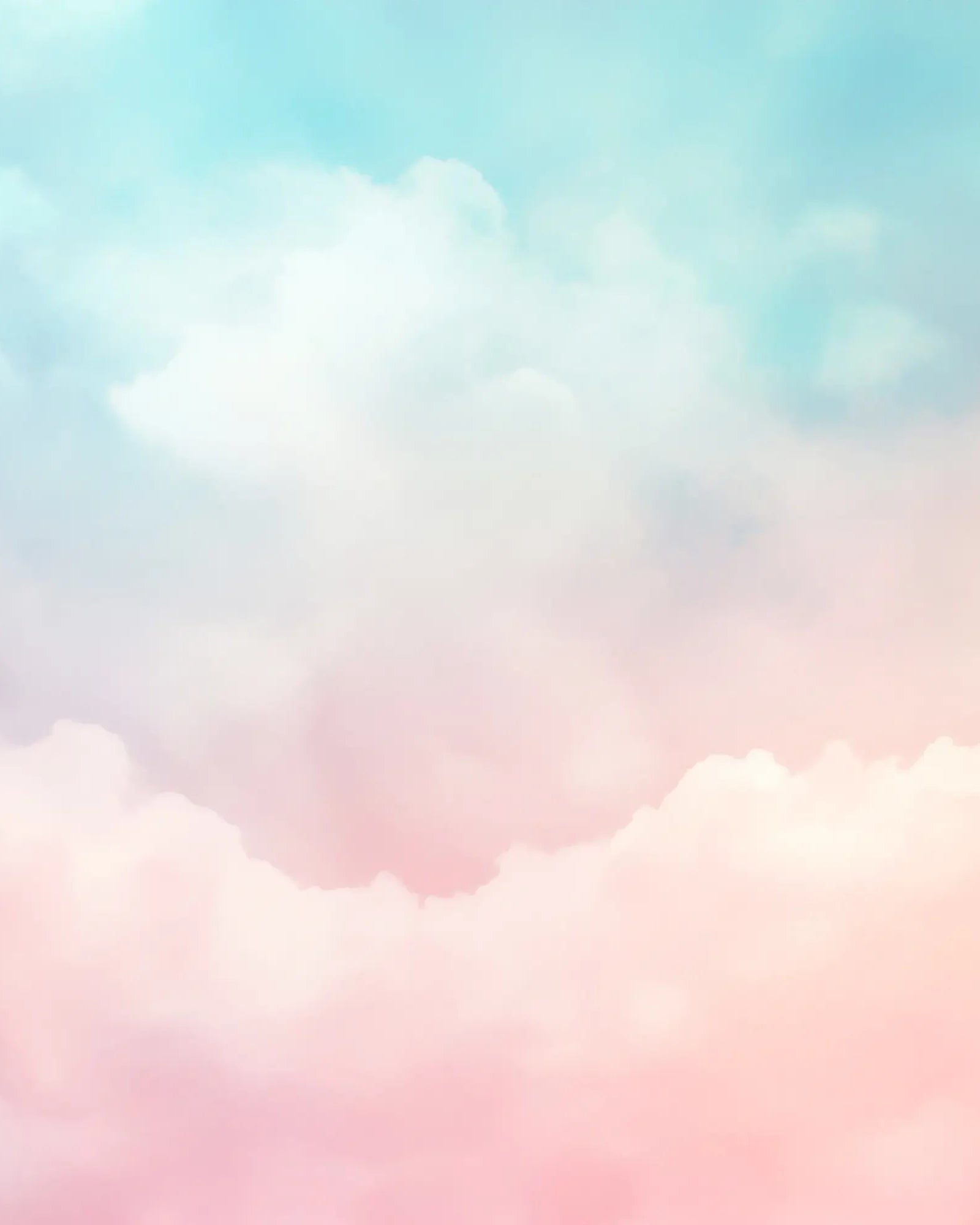Pastel-colored clouds in a soft gradient sky