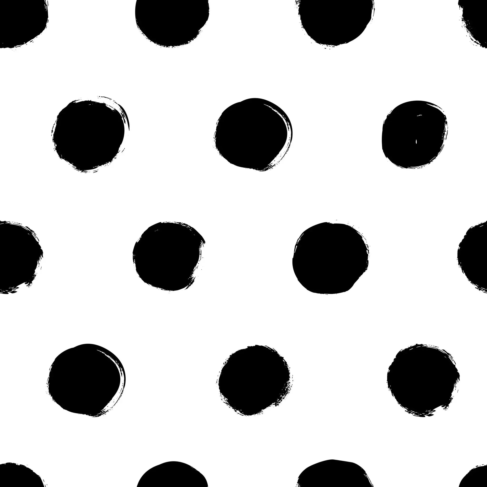 Pattern of black polka dots on a white background