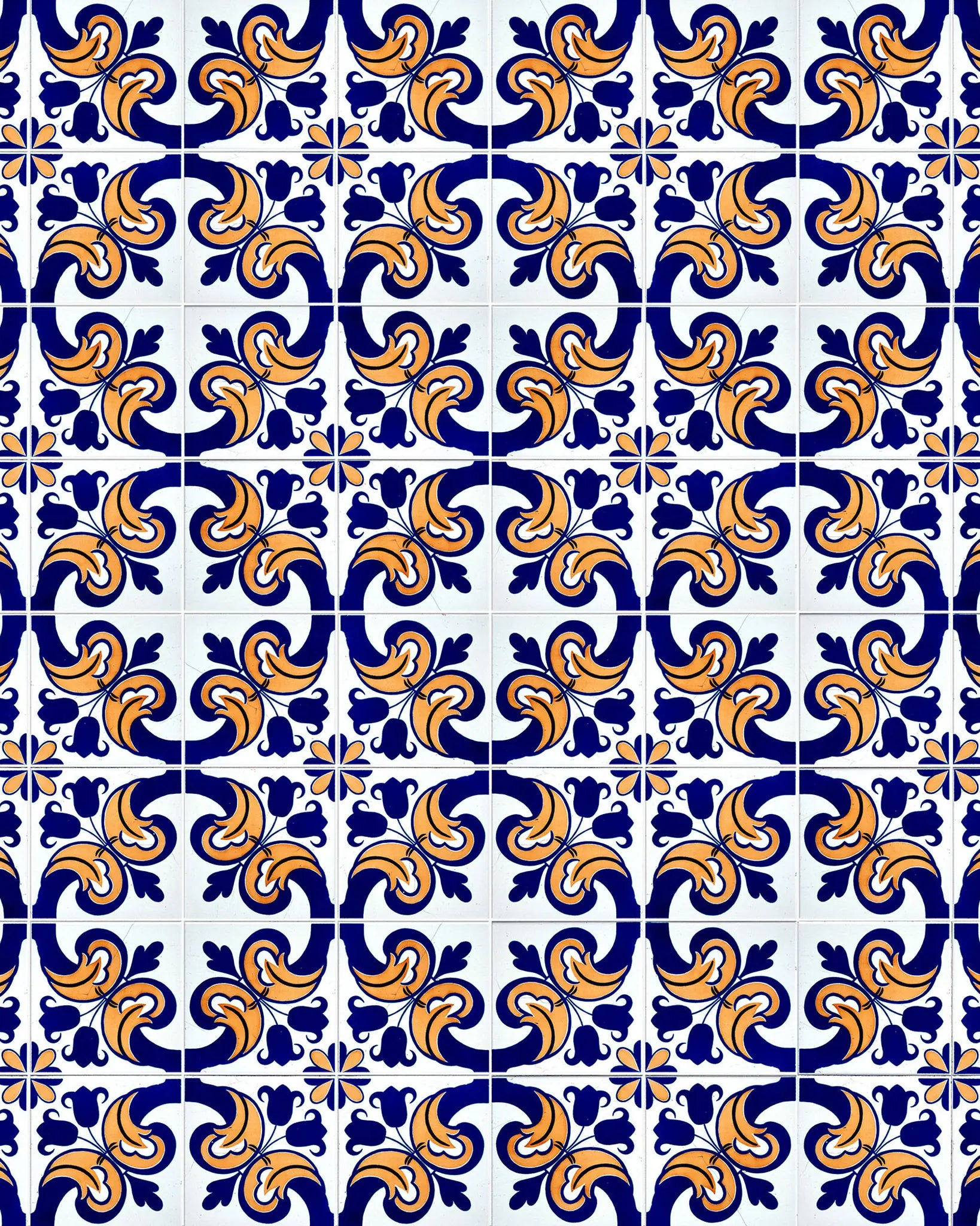 Pattern of blue and orange tiles with intricate designs on a white background