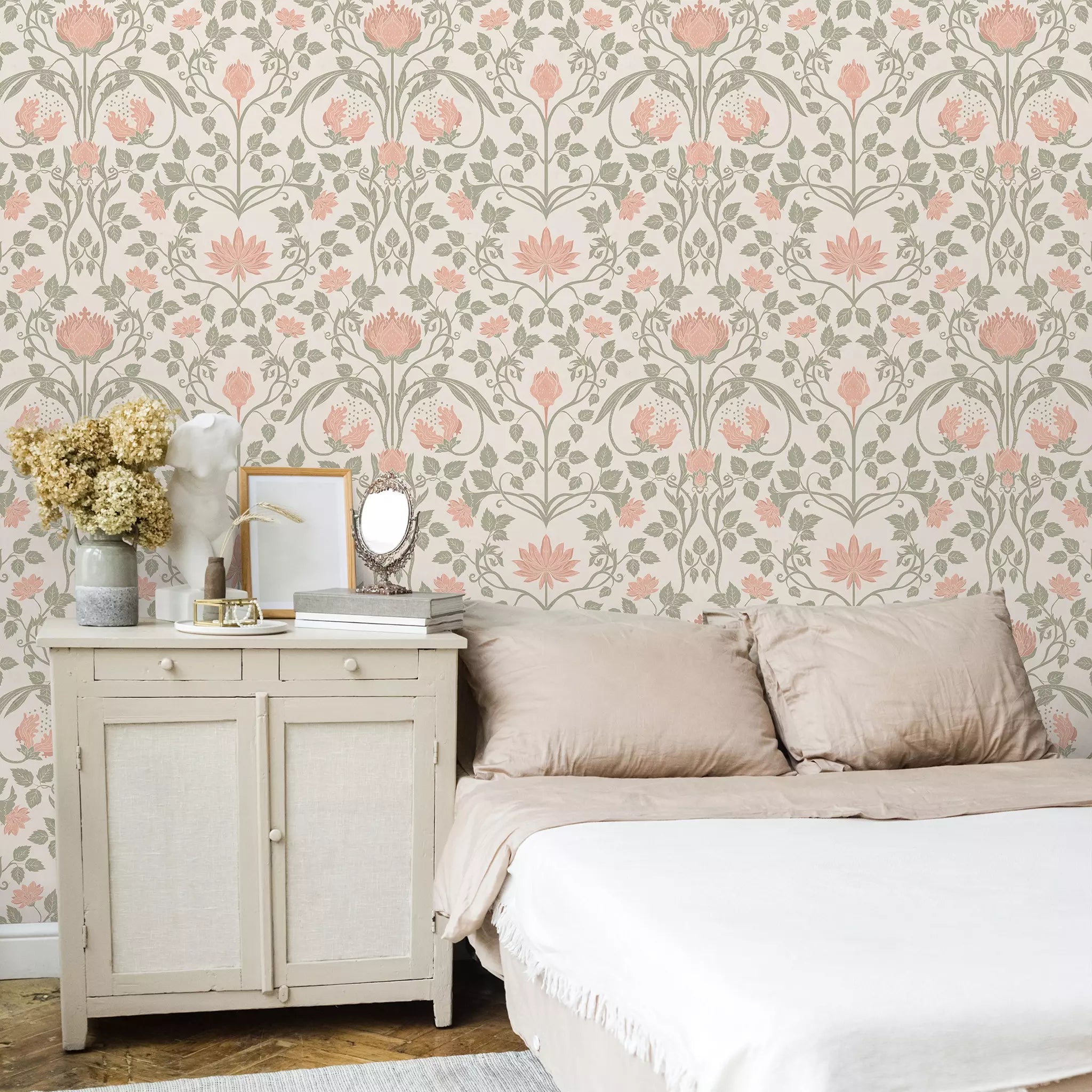Bedroom with floral wallpaper, bed, and side table.