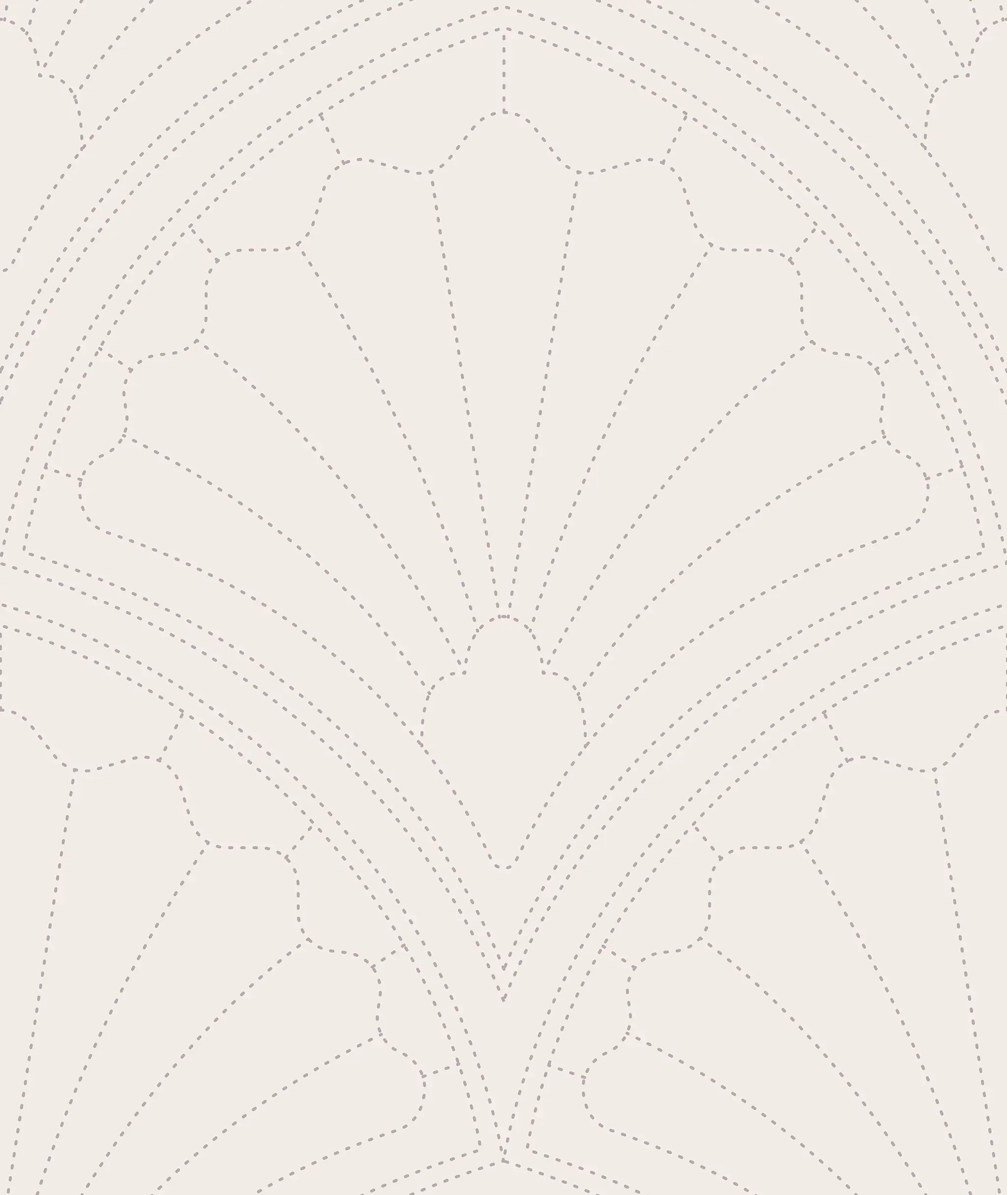 Close-up of a quilted fabric pattern with radiating lines on a light background